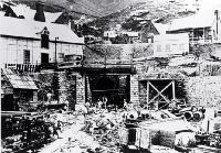 The Lyttelton portal of the Lyttelton Rail Tunnel with construction workers [1867]