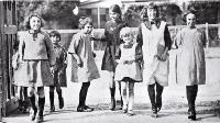 Are we downhearted? : girls merrily on their way to Phillipstown School on the day Christchurch schools reopened after five months due to the removal of restrictions on the assembly of children after the end of the infantile paralysis epidemic [1925]